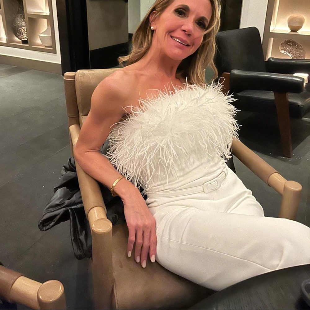 NADINE MERABI WHITE JUMPSUIT WITH FEATHERS